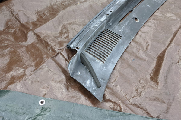 Foam wedge seals attached to the underside of the cowl panel